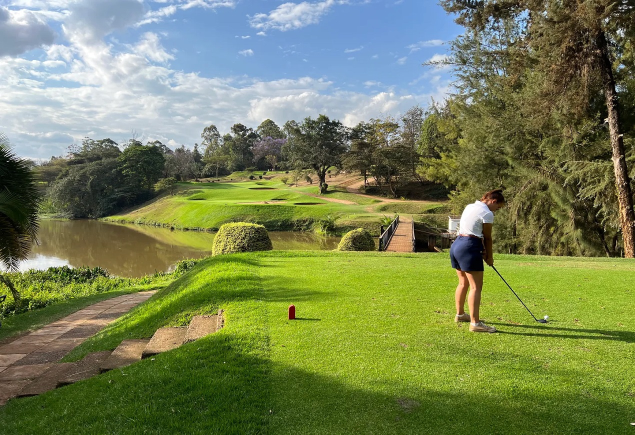 Golfer lining up a putt at Muthaiga Golf Club