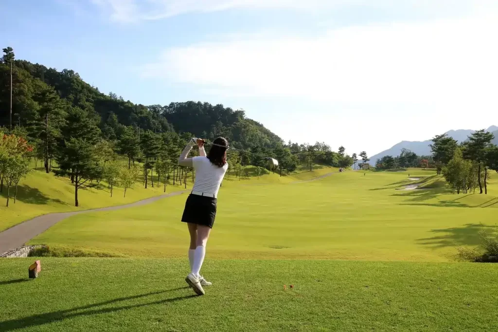 Golfer putting on a meticulously manicured green at Great Rift Valley Lodge & Golf Resort, offering breathtaking views for Kenya golf holidays.