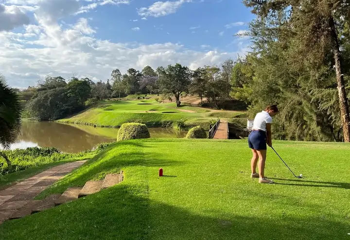 Golfer on Kenya Safari lining up a putt at Muthaiga Golf Club